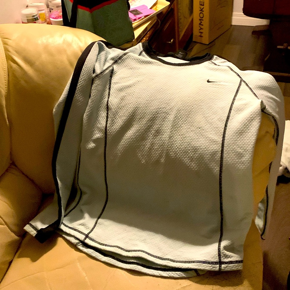 Size m/l Nike pullover long sleeve top. Light blue with black striping.
